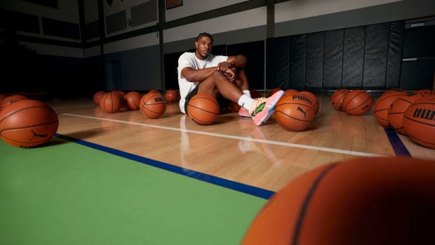 Scoot Henderson modeling his peach and green PUMA sneakers.